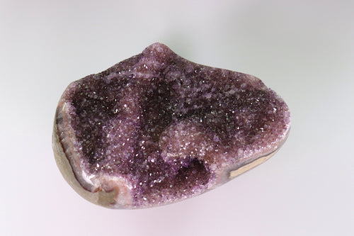 Amethyst crystal on a white background
