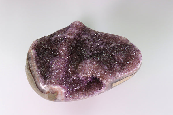 Amethyst crystal on a white background