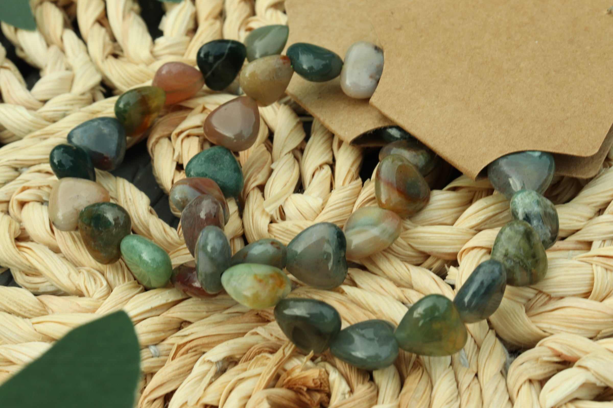 Mixed Agate Heart shaped beads bracelet on a woven surface