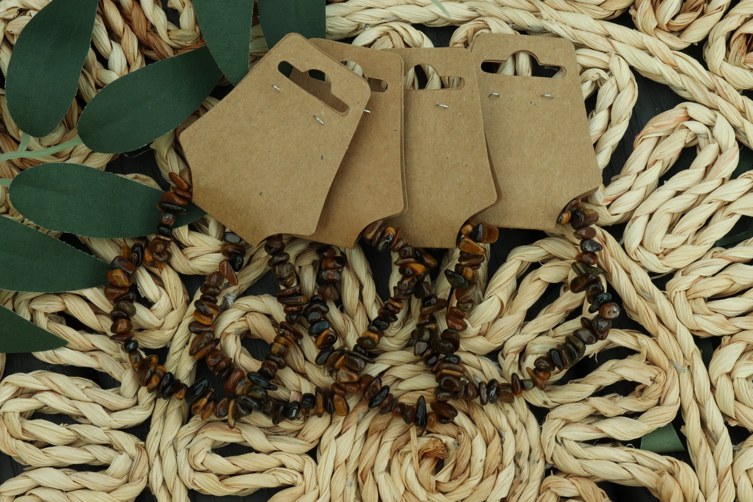 Tigers eye chip bracelet on a brown woven surface 