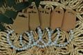 Set of blue lace agate bracelets on a textured woven surface with a white beaded necklace.