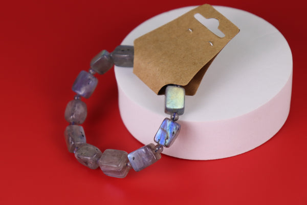 Labradorite bracelet with multicolored beads on a red background