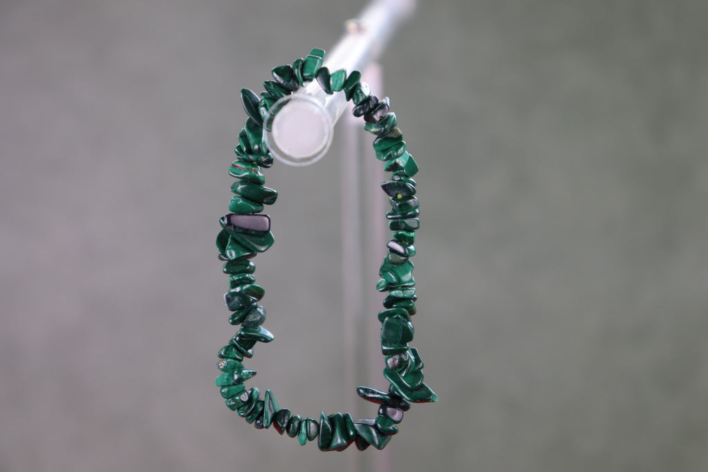 Green malachite ship bracelet on a gray background